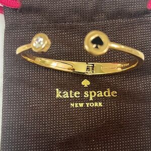 Authentic Kate Spade bracelet gold color w/clear stone 1 side,black spade other